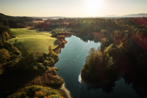 Drone recording of the Koglweiher in Ellbach, Upper Bavaria, in the autumnal morning mood Drone recording of the Koglweiher in Ellbach, Upper Bavaria, in the autumnal morning mood